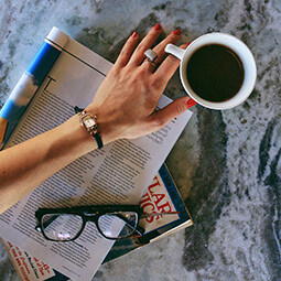 woman watch coffee fashion reading hand flat-lay magazine glasses branded UGC content