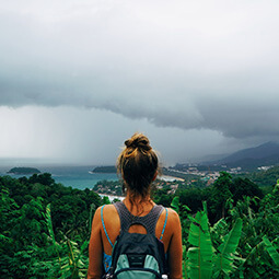 girl back-packer hiker view follow-me looking landscape water sea island volcano clouds tropical real UGC travel content photography